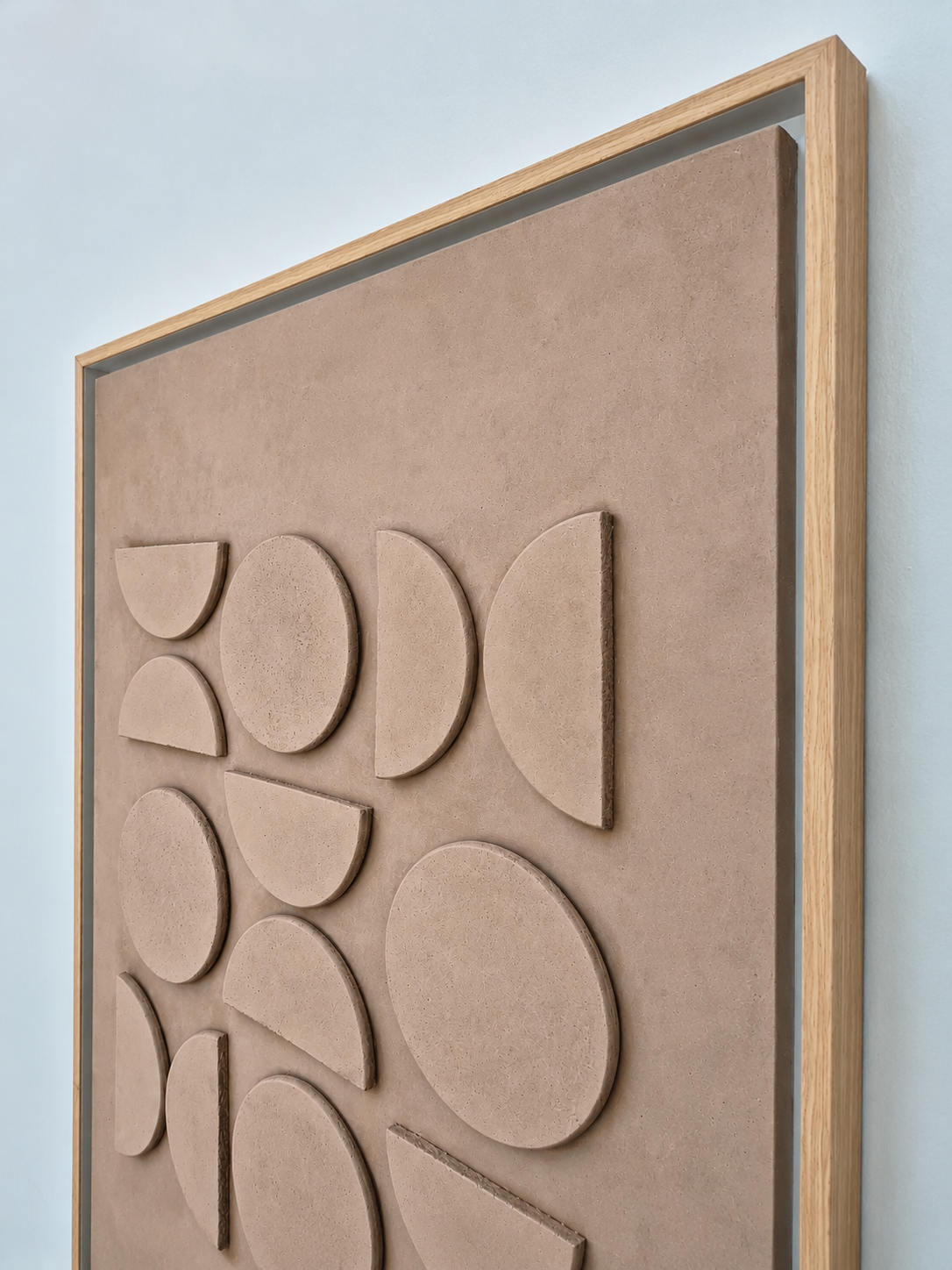 Modern geometric wall décor with beige frame