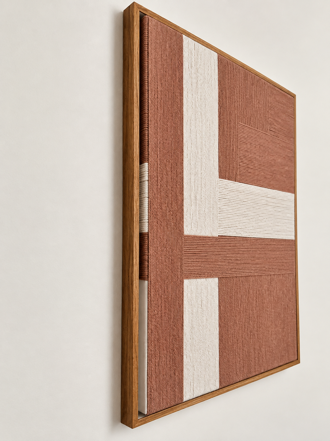 Geometric woven wall art with walnut frame